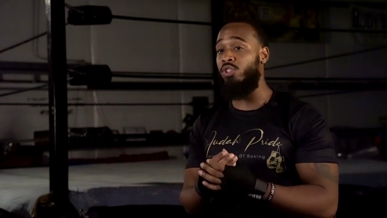 Coach Tyrone Judah beside the ring at Judah Pride The Academy of Boxing